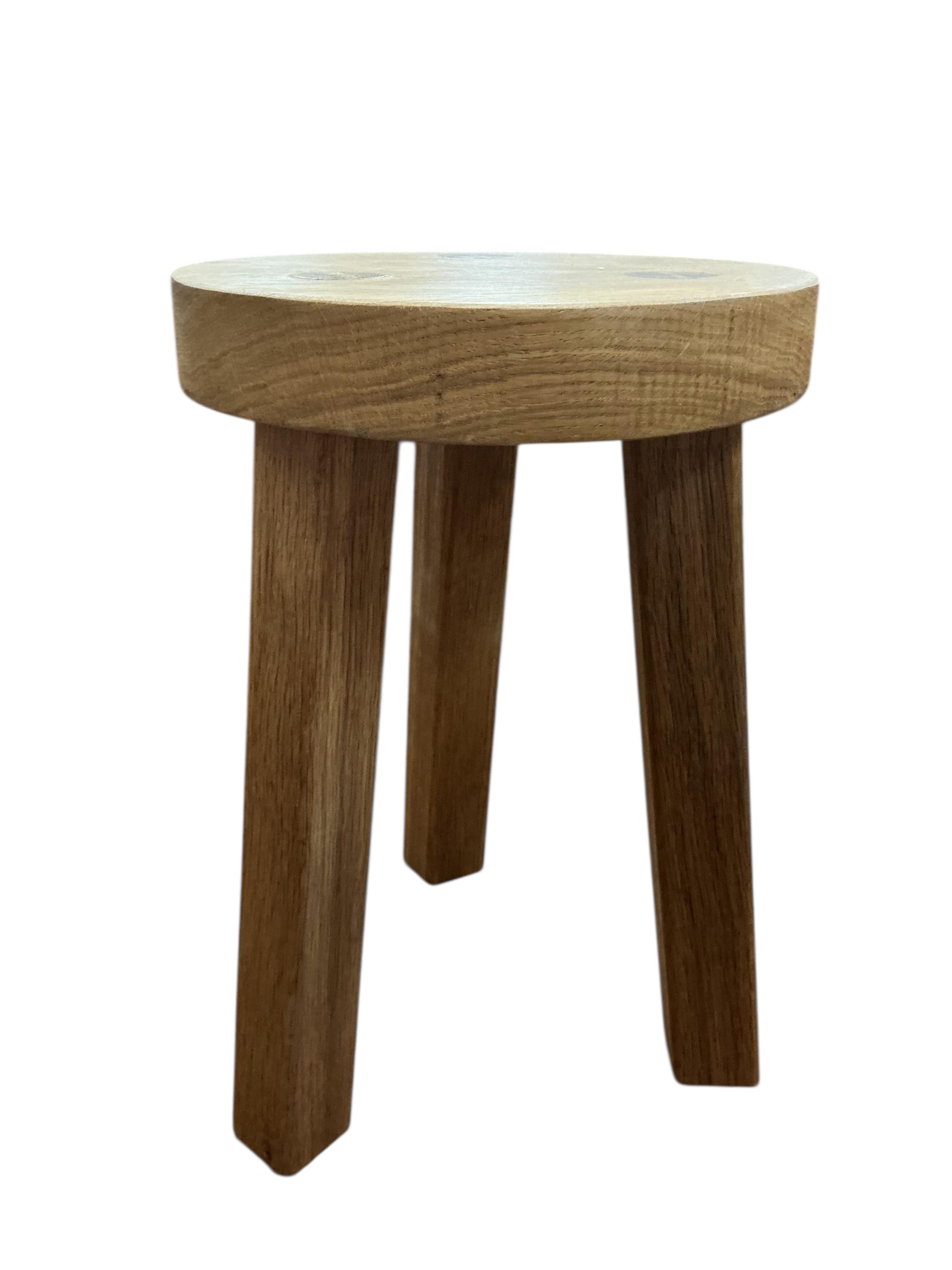 A pair of contemporary circular oak stools, diameter 24cm, height 36cm